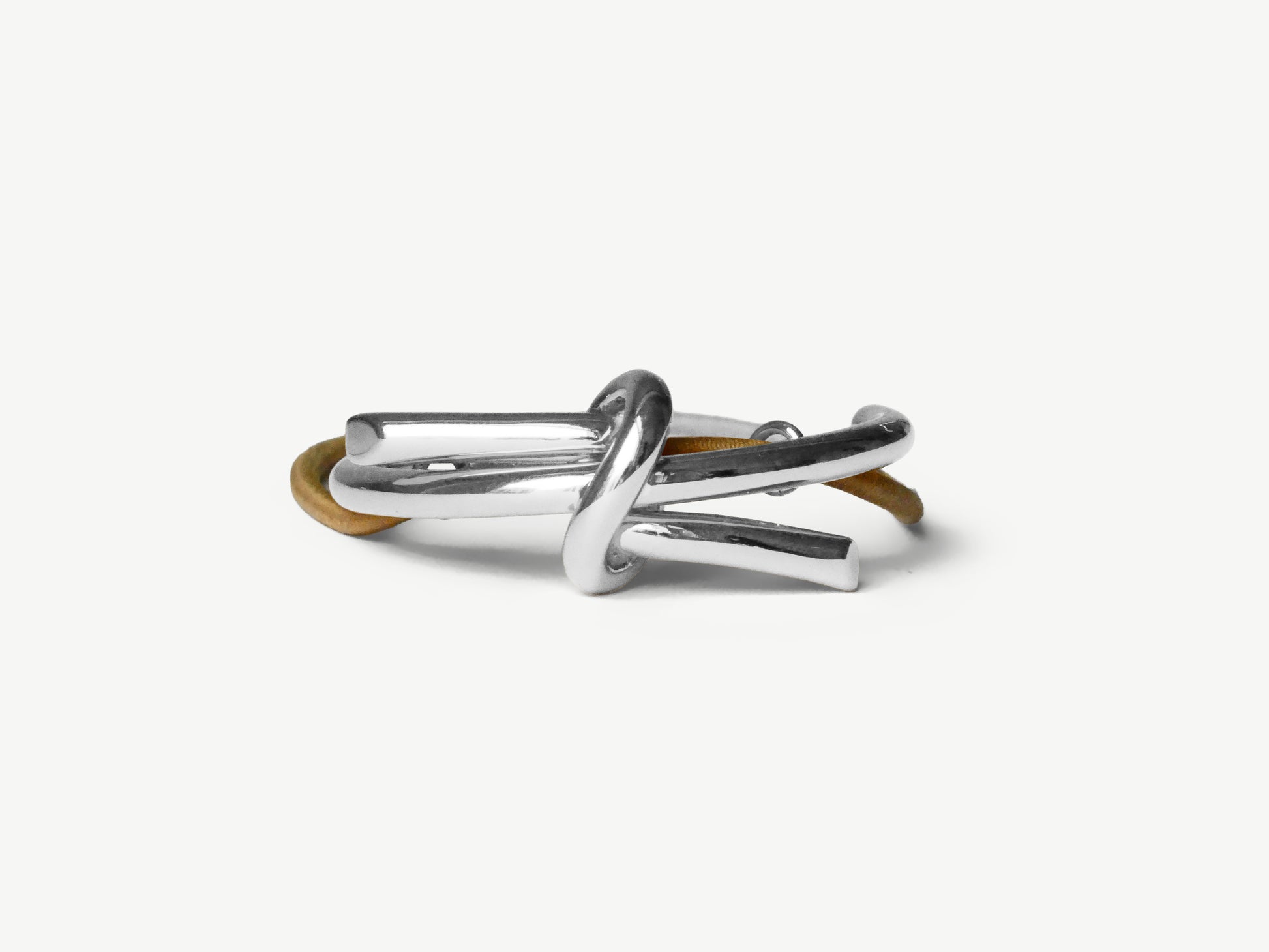 clōw atelier small knot hair accessory, silver white gold, on blond elastic, elegant for ponytail or bun
